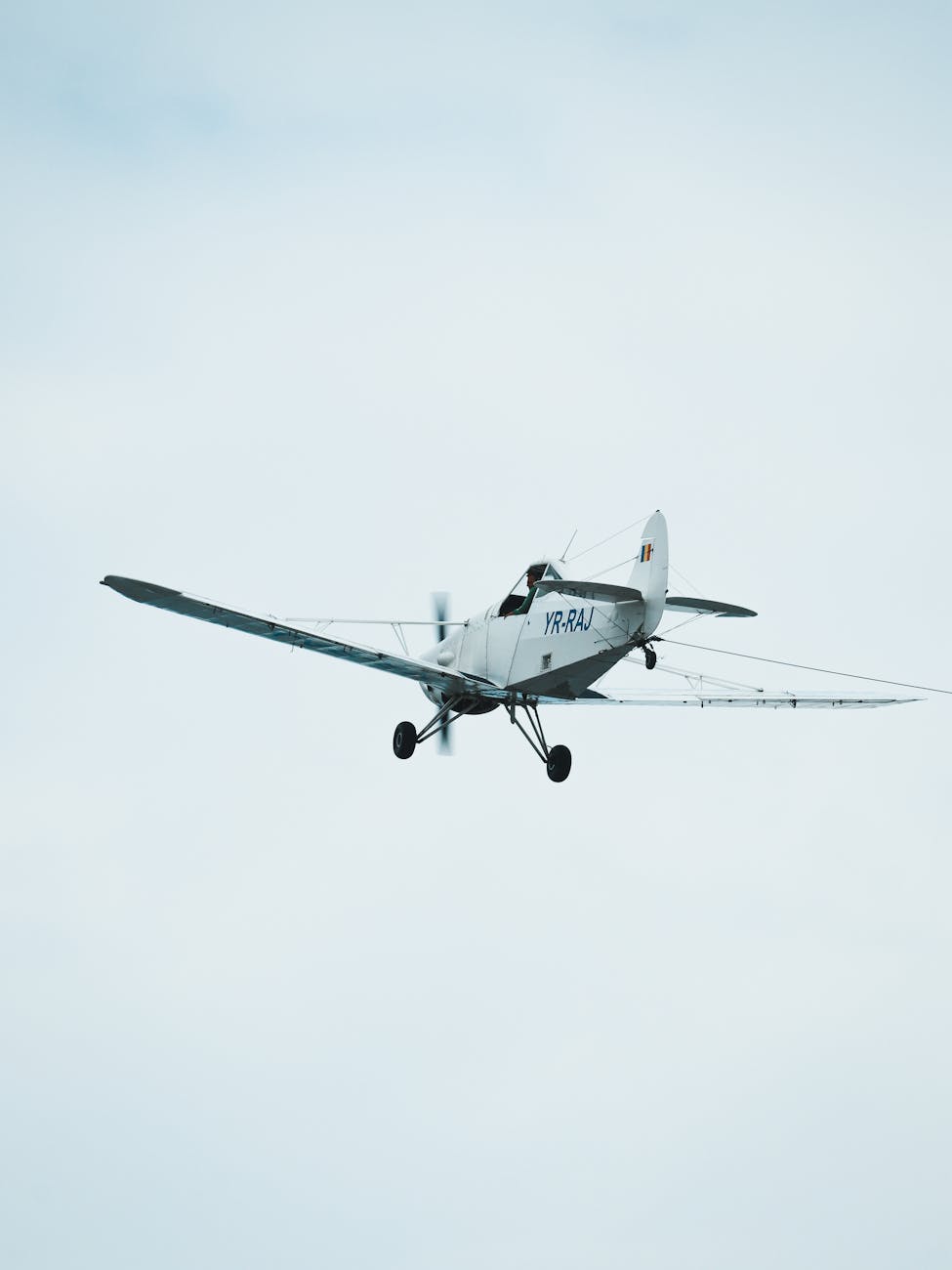 Airplane flying through sky - international flights to get to Osaka