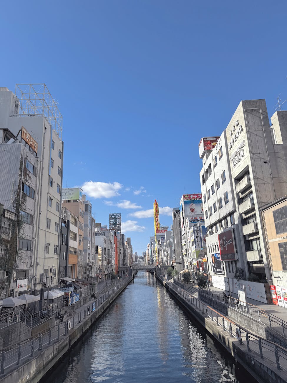 Dotonbori River Osaka under clear blue sky - best time to visit Osaka in spring or autumn
