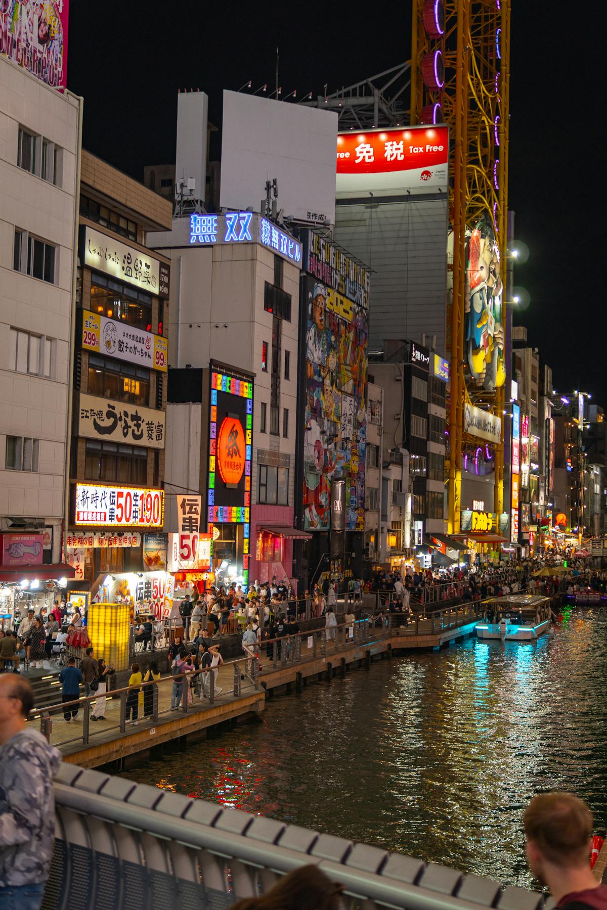 Dotonbori Canal at night with illuminated signs — Osaka shopping and entertainment district