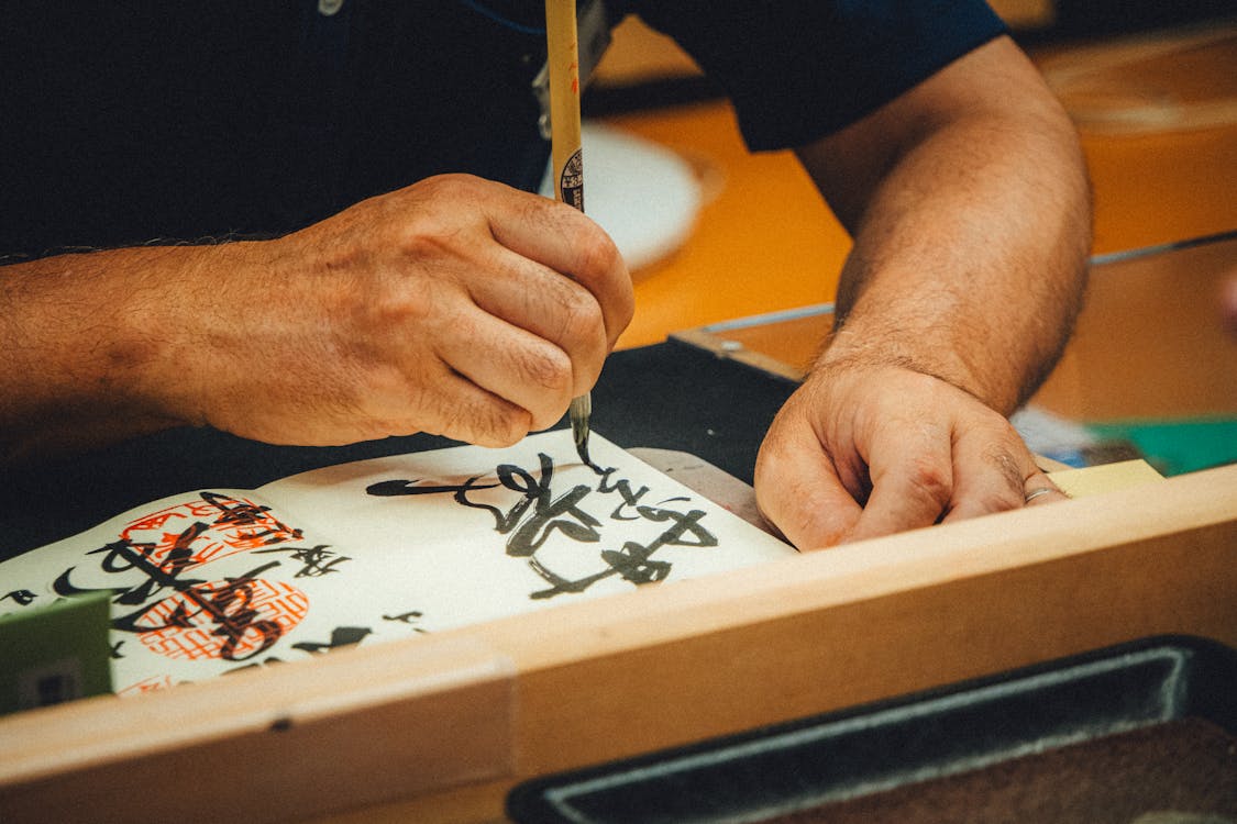 Japanese calligraphy brush writing art - hands-on Osaka cultural experiences workshop