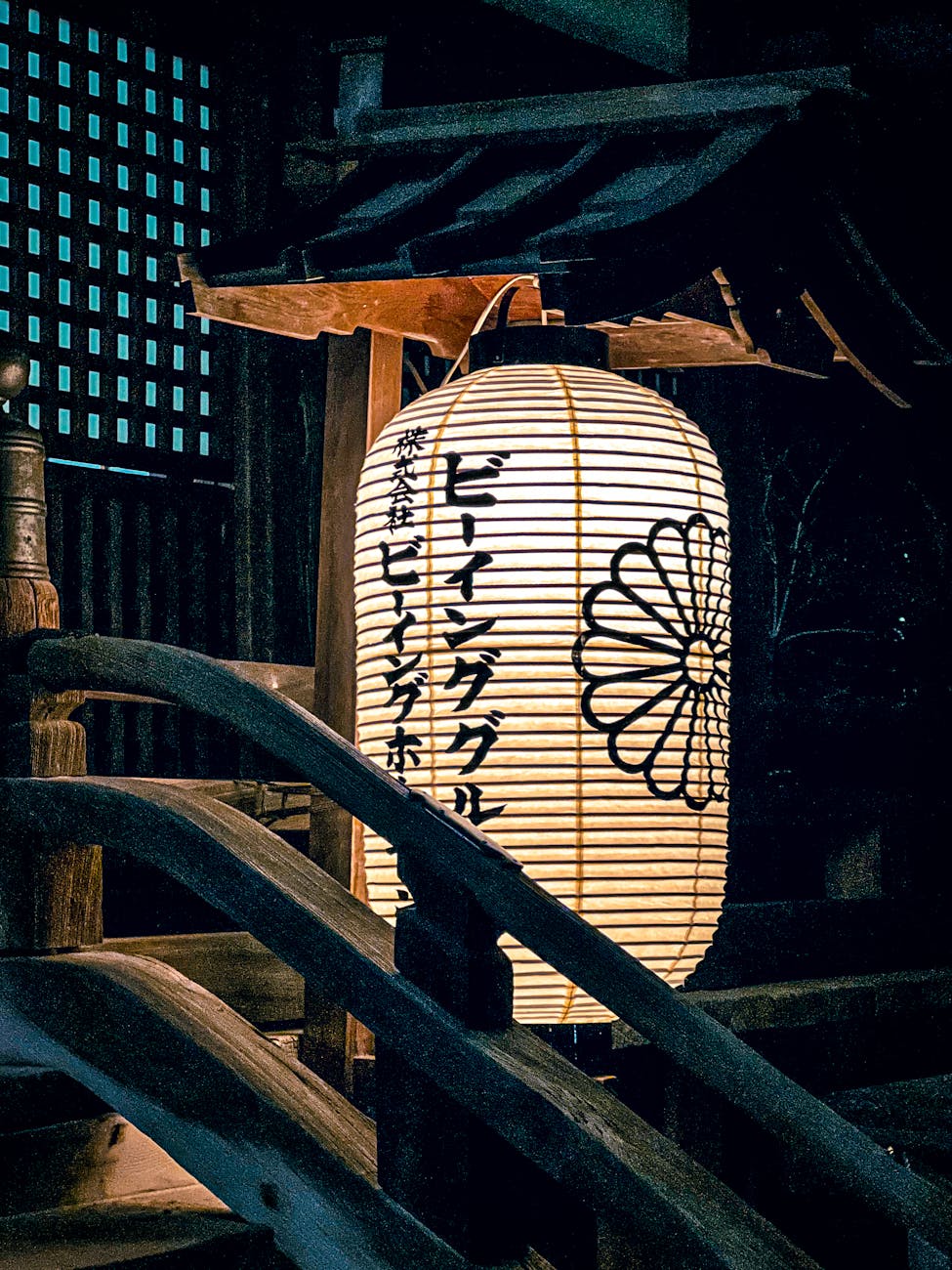 Japanese lantern illuminated at night near temple - atmospheric Osaka temples and shrines