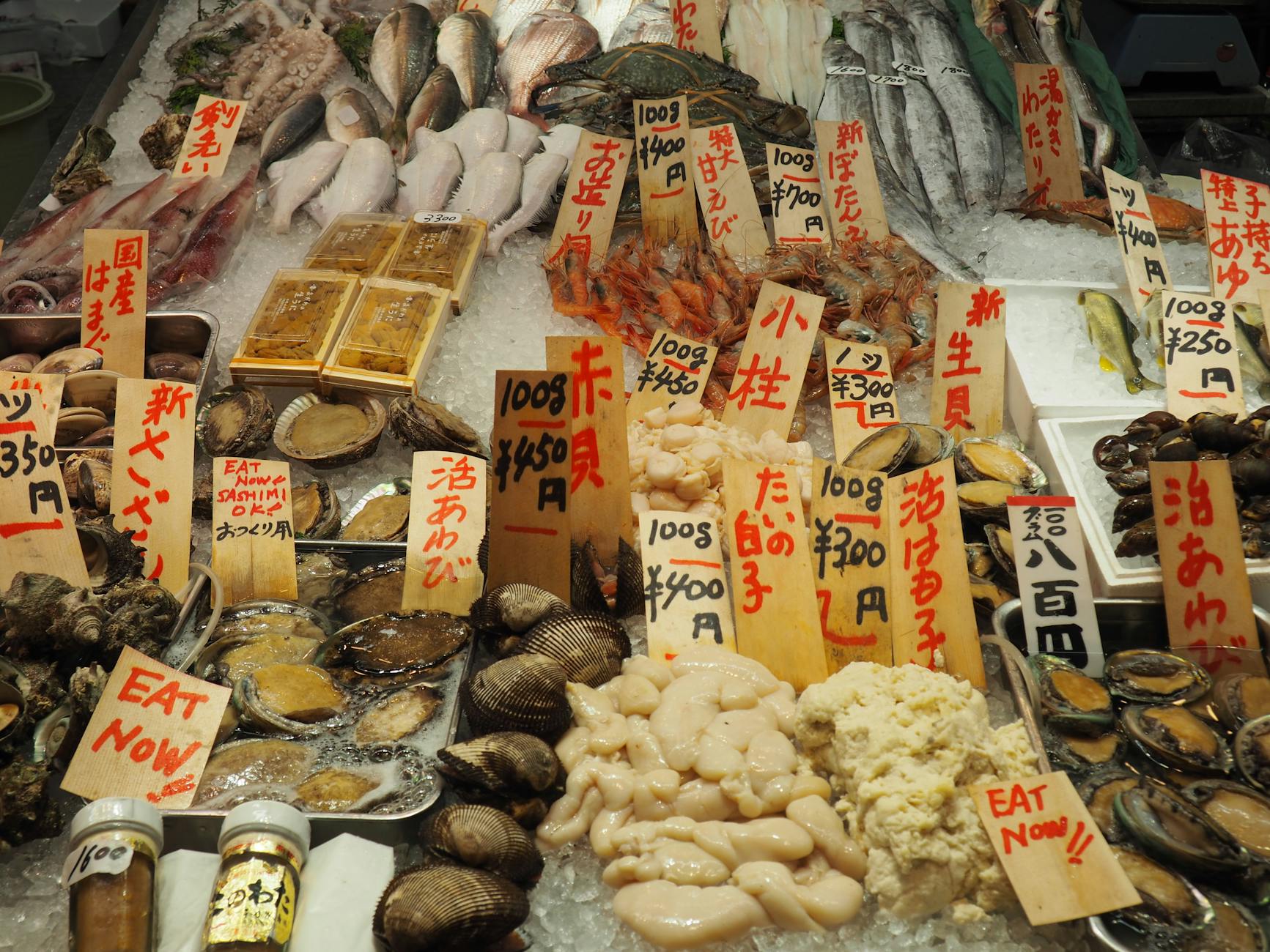 Fresh seafood display at Kuromon Market in Osaka