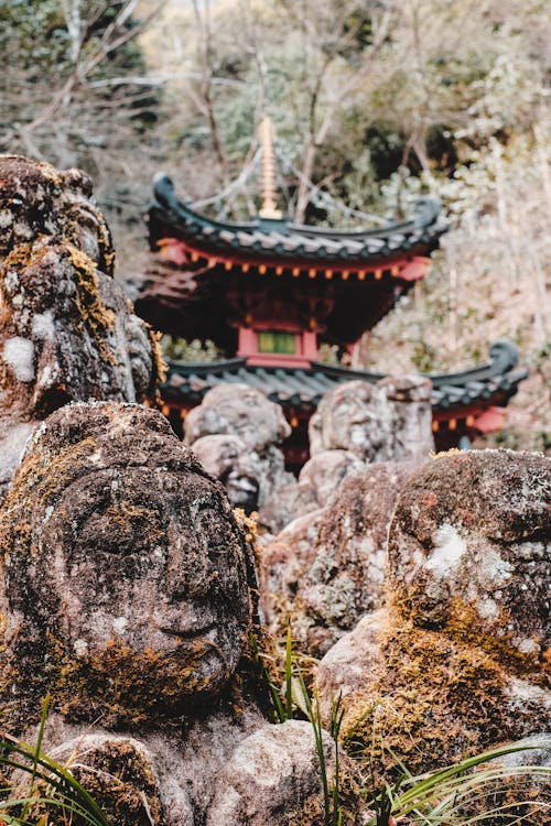 Moss-covered stone statues at a serene Japanese temple - spiritual Osaka hidden gems