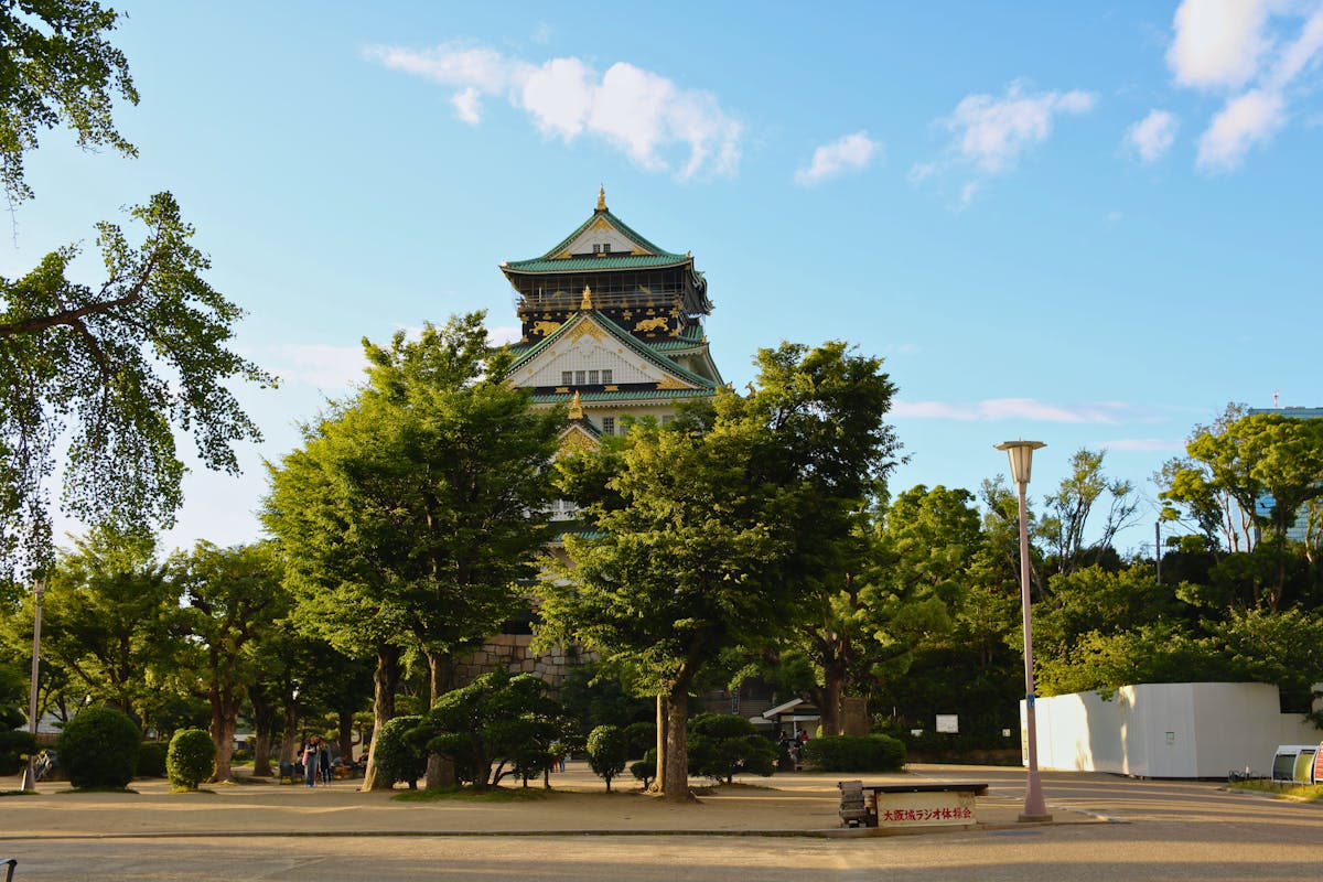 Osaka with kids at Osaka Castle Park surrounded by lush greenery