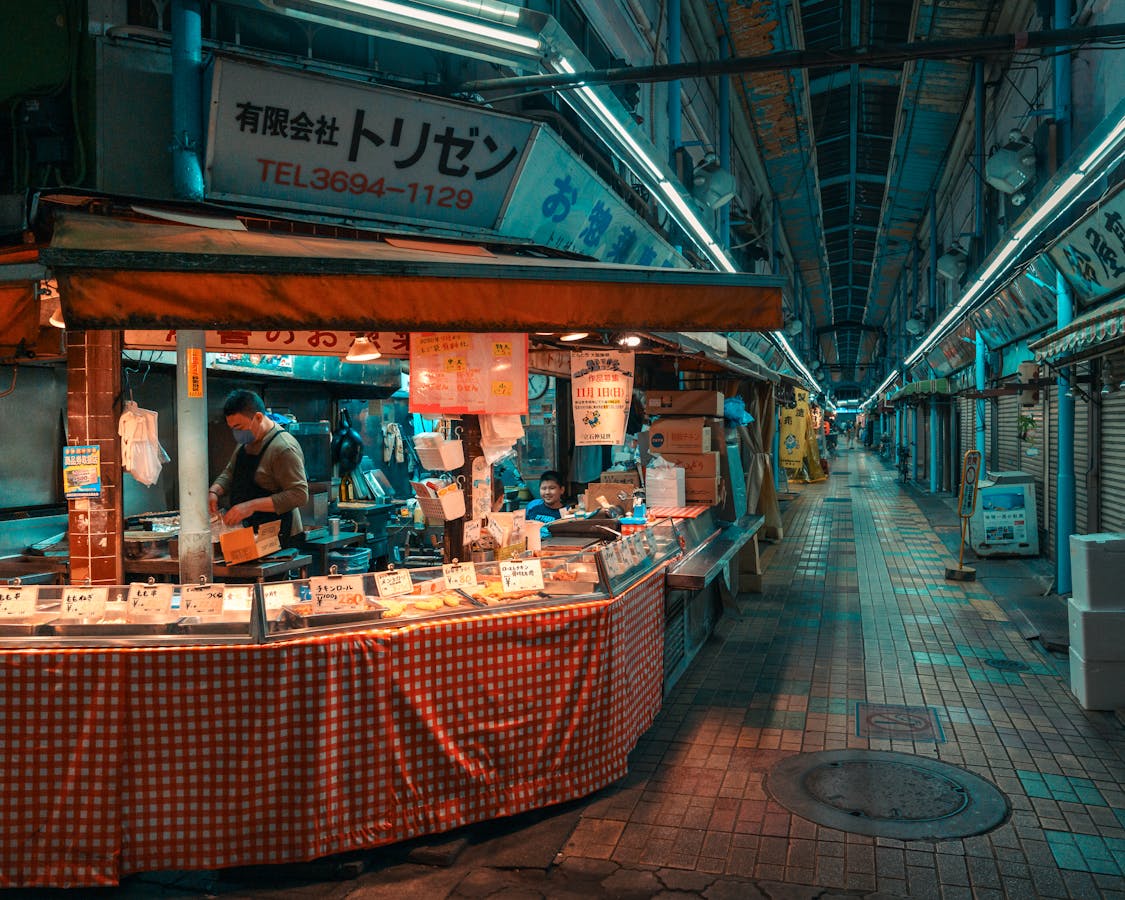 Japanese street market vendor at dusk - best markets in Osaka
