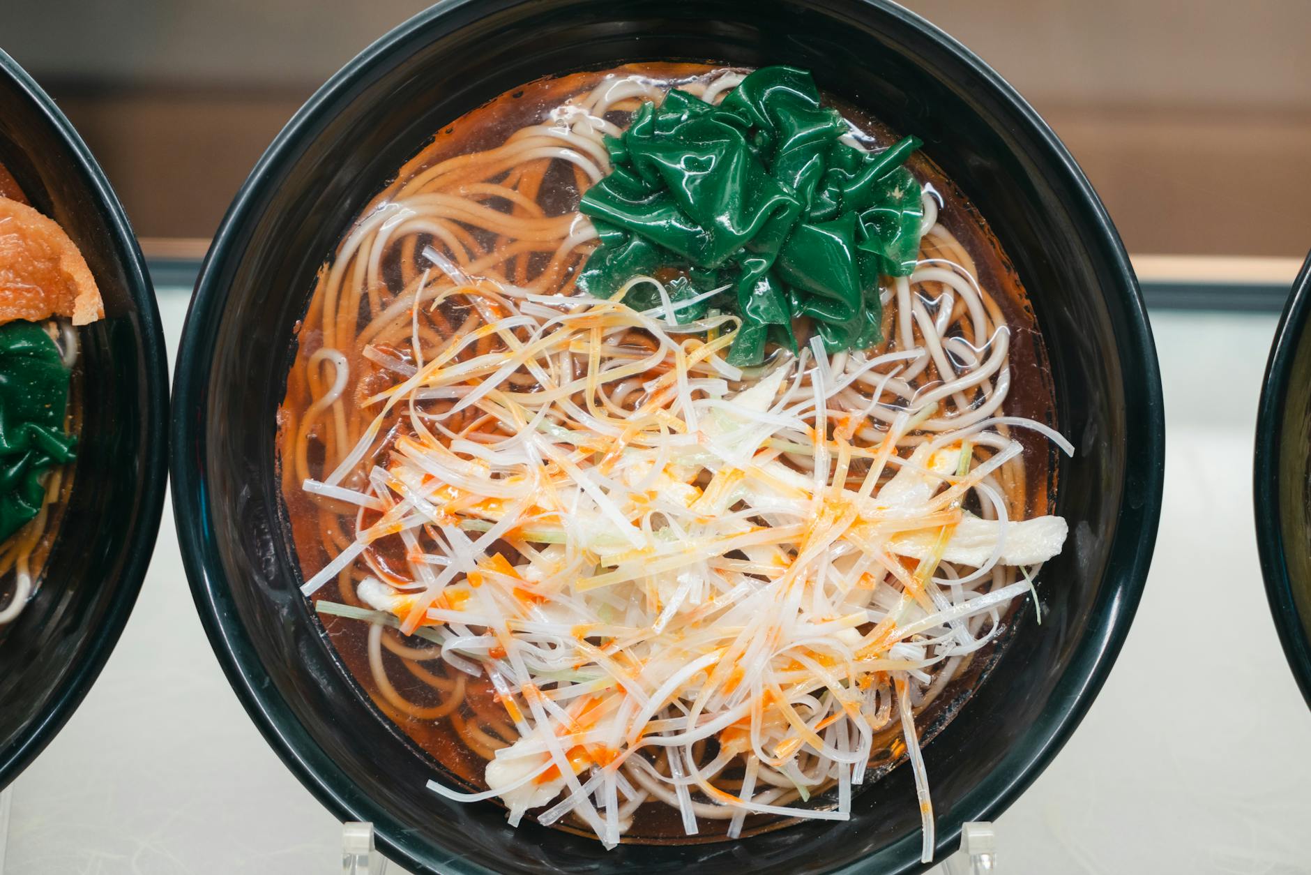 Rich ramen noodle bowl with chashu pork and soft-boiled egg in Osaka