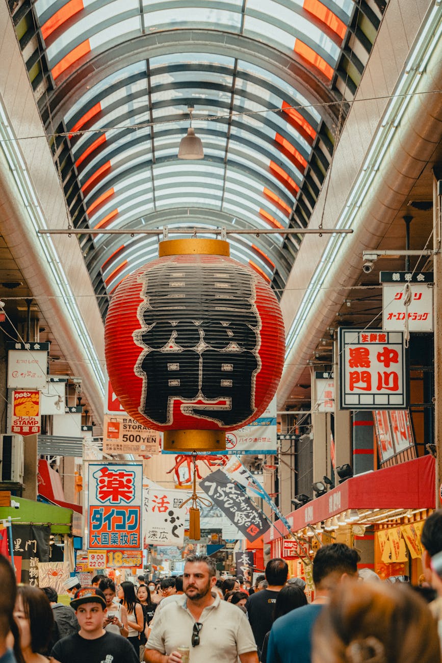 Covered shopping arcade in Osaka with lanterns - free window shopping for Osaka budget travel