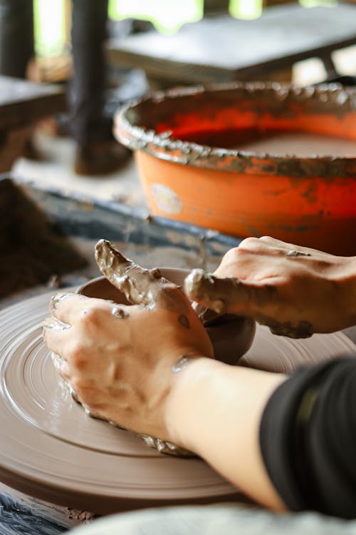 Hands shaping clay on pottery wheel - craft workshop Osaka cultural experiences