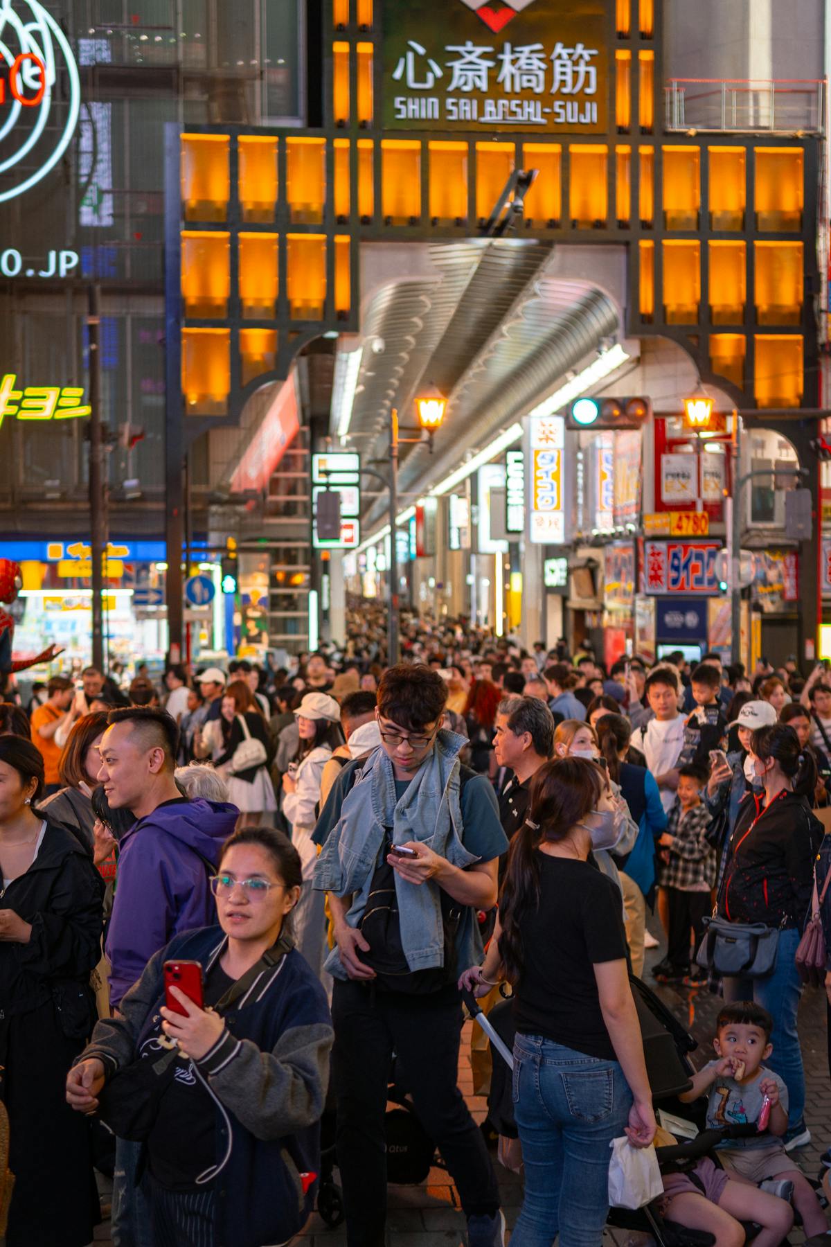 Osaka nightlife in Shinsaibashi district with bright city lights and crowds