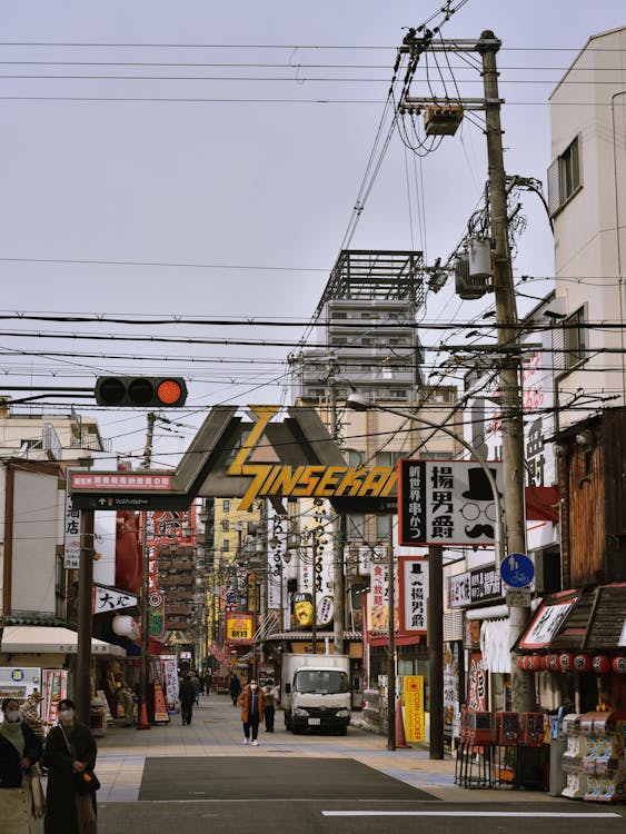 Retro Shinsekai street with Tsutenkaku Tower - underrated Osaka hidden gems neighborhood