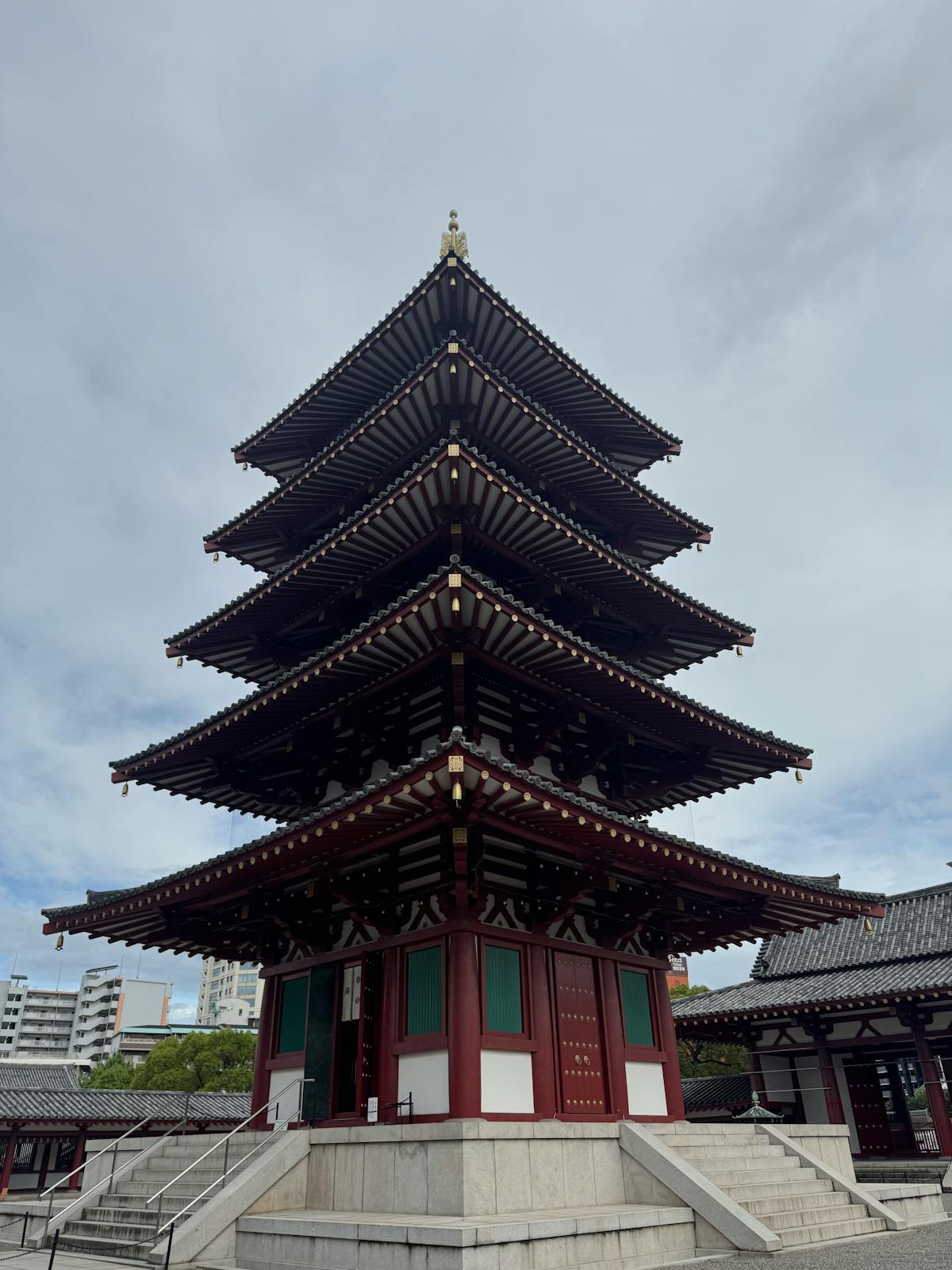 Shitennoji Temple five-story pagoda in Tennoji Osaka neighborhood under blue sky