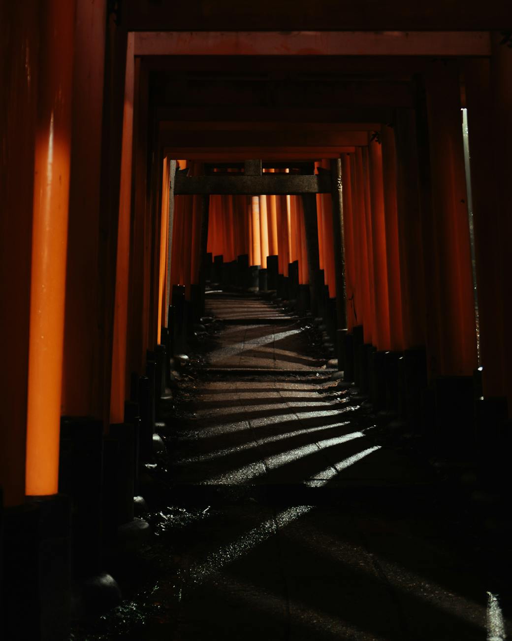 Red torii gates at Japanese shrine - traditional entrance to Osaka temples and shrines