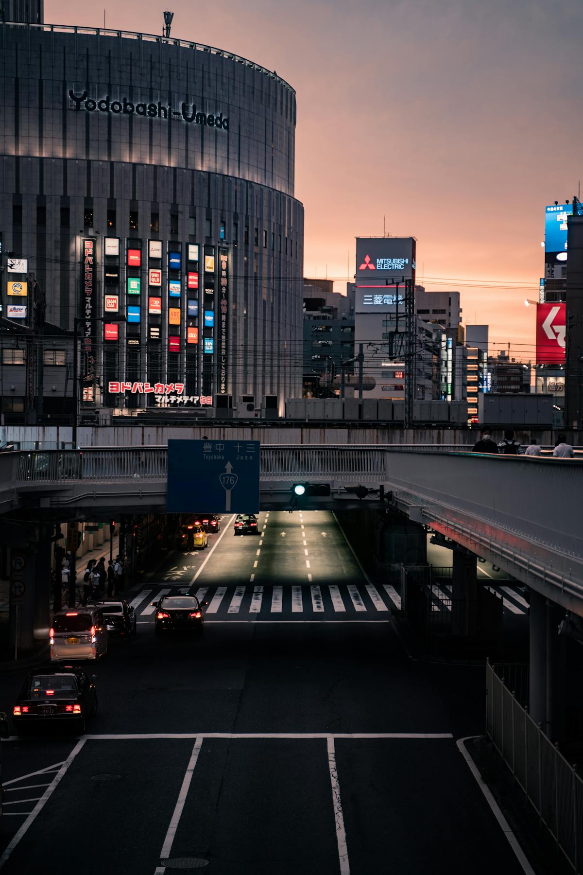 Umeda shopping district in Osaka at twilight with modern retail buildings