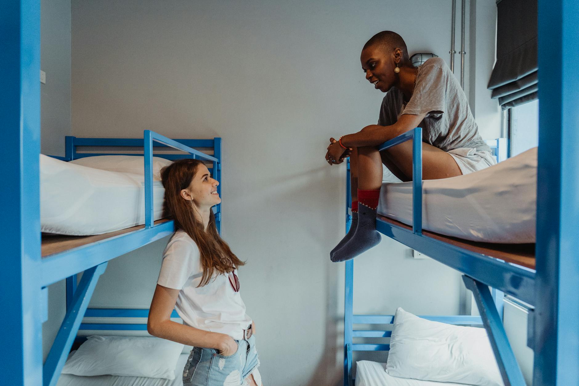 Travellers relaxing in a social dorm at a cheap Osaka hostel