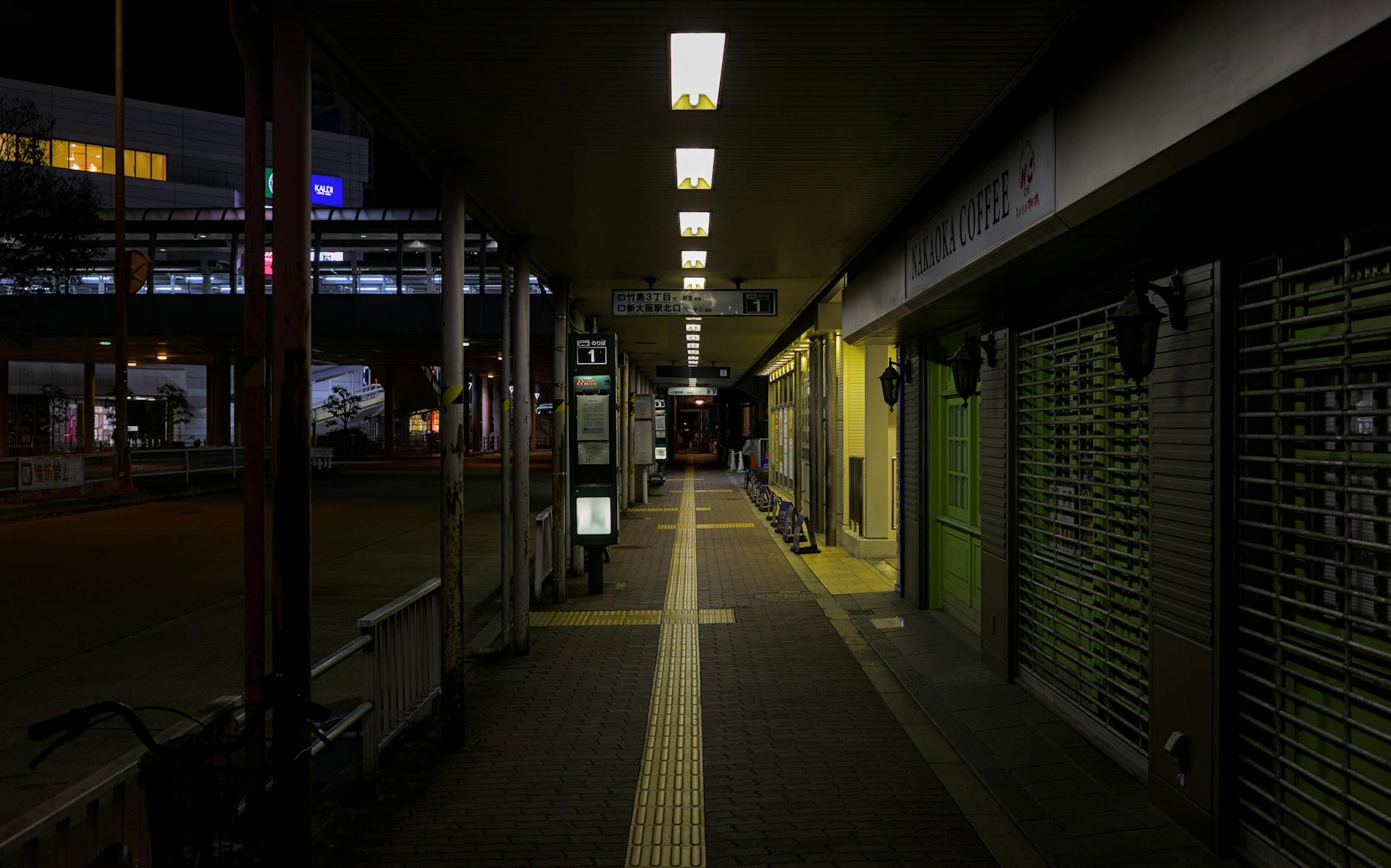 Osaka train station walkway at night near the budget hostel districts