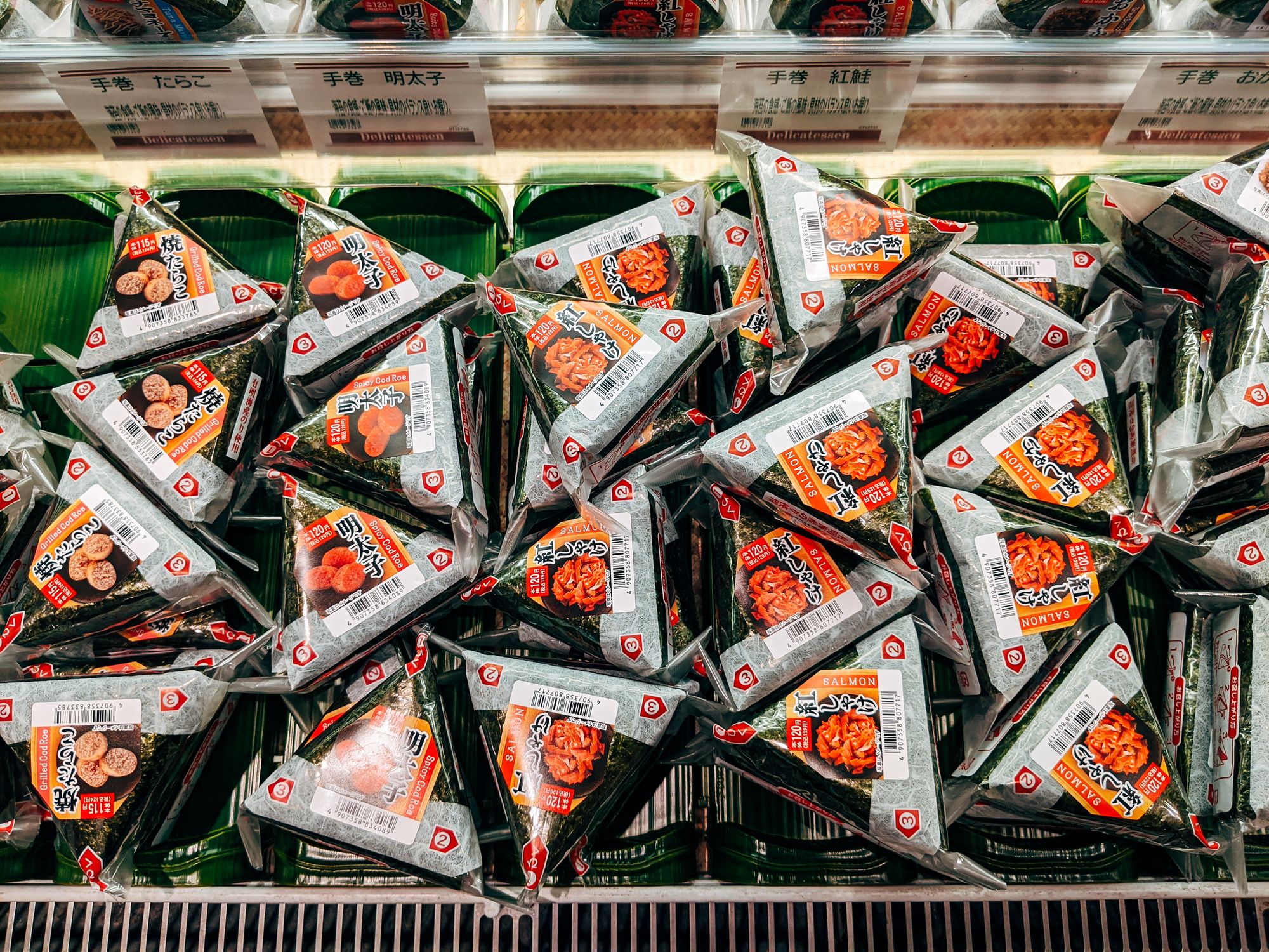 Onigiri rice balls on a Japanese convenience store shelf where you can pay with an ICOCA card in Osaka