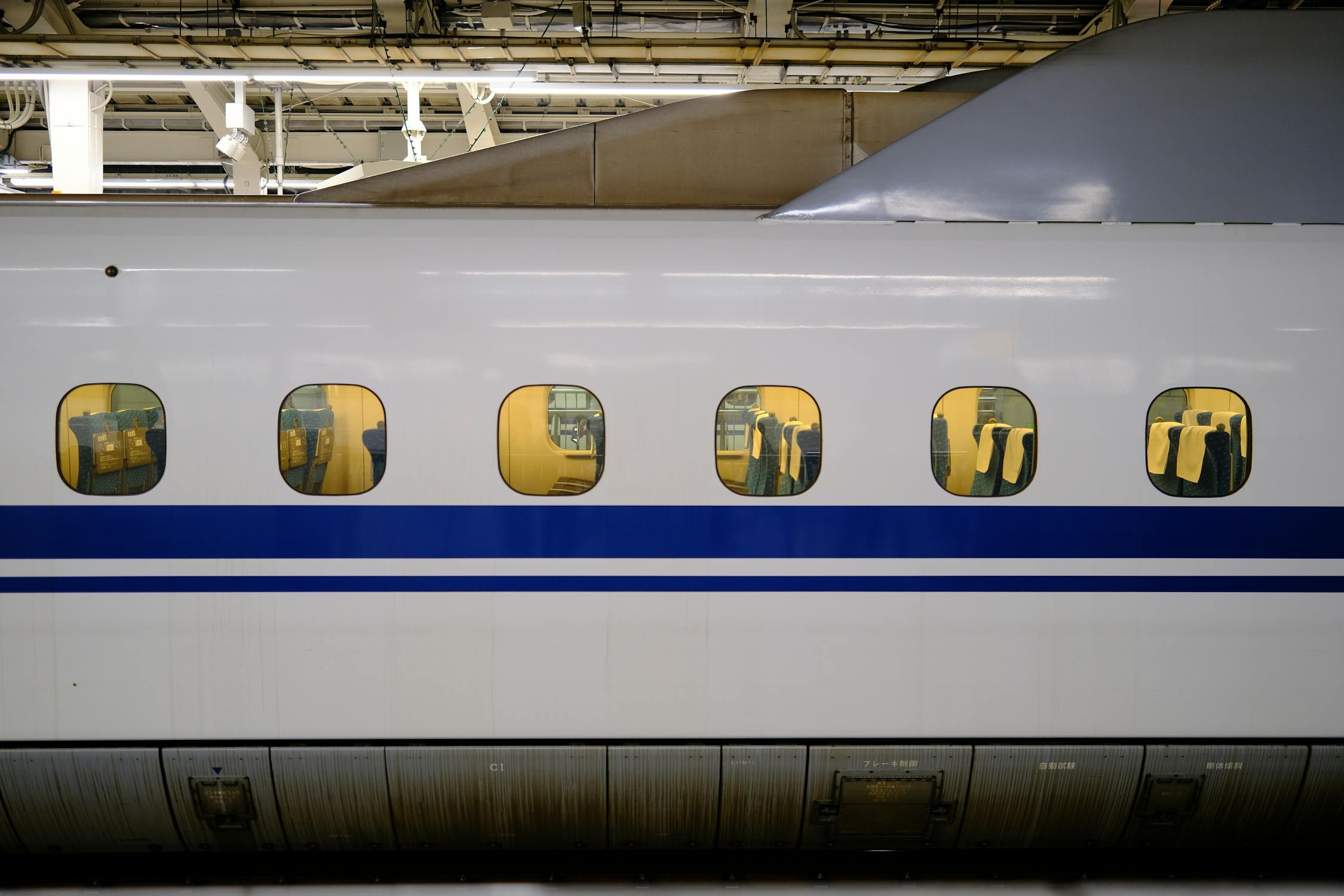 Interior of a Shinkansen bullet train with reserved seats you book free on a JR Pass