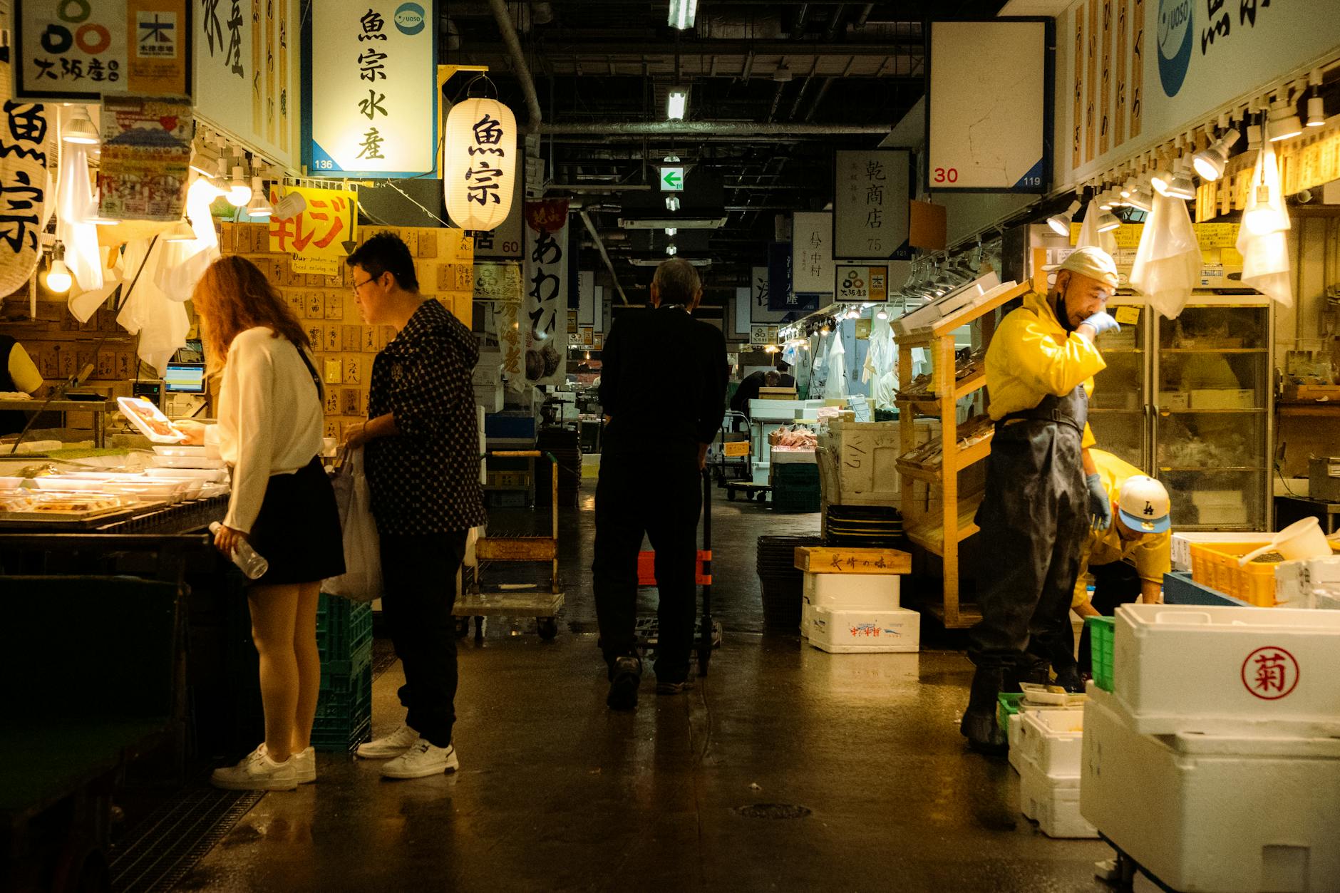Fresh seafood on display at a covered market in Osaka, like Kuromon Market