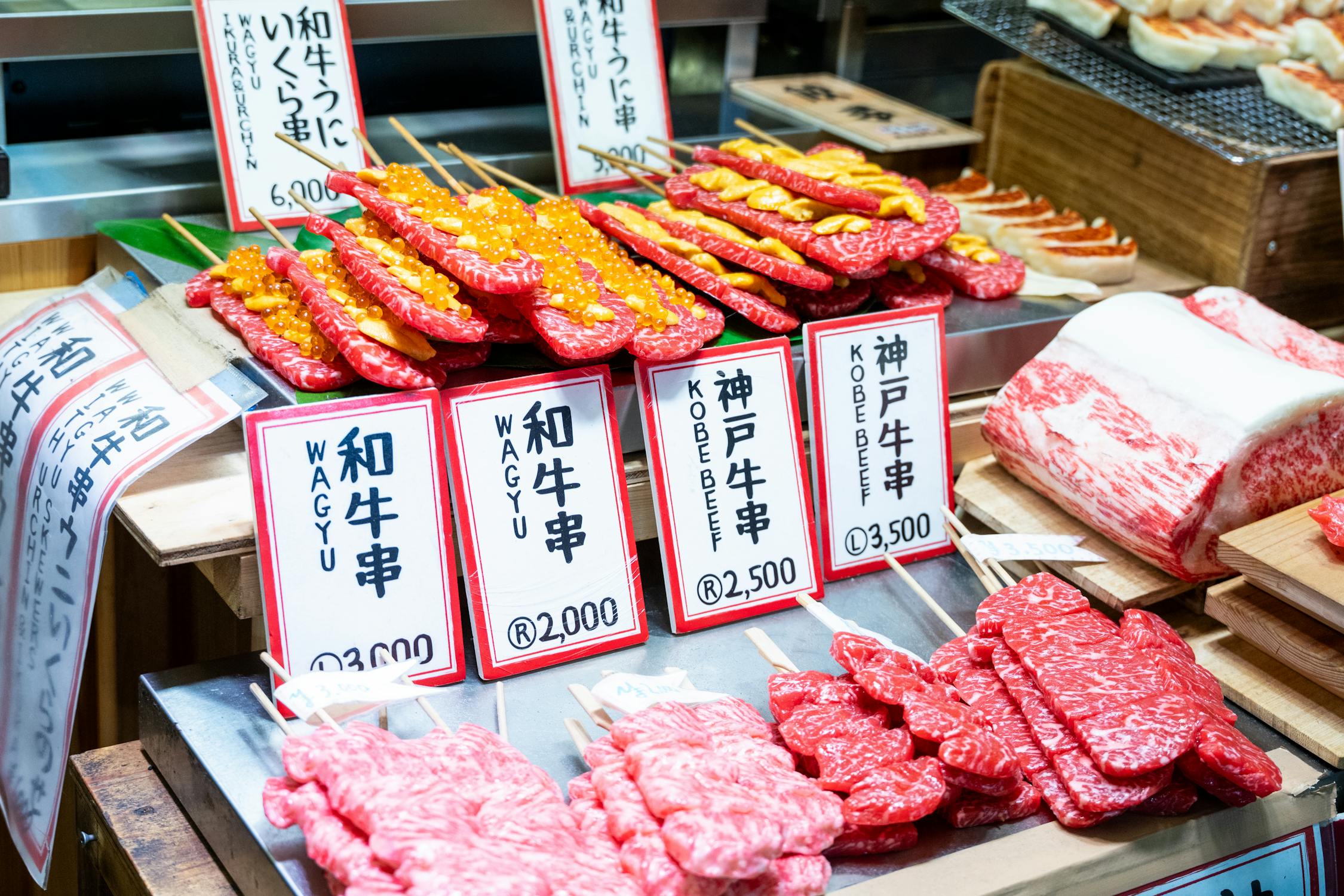 Wagyu and Kobe beef skewers on display at a Japanese market stall in Osaka