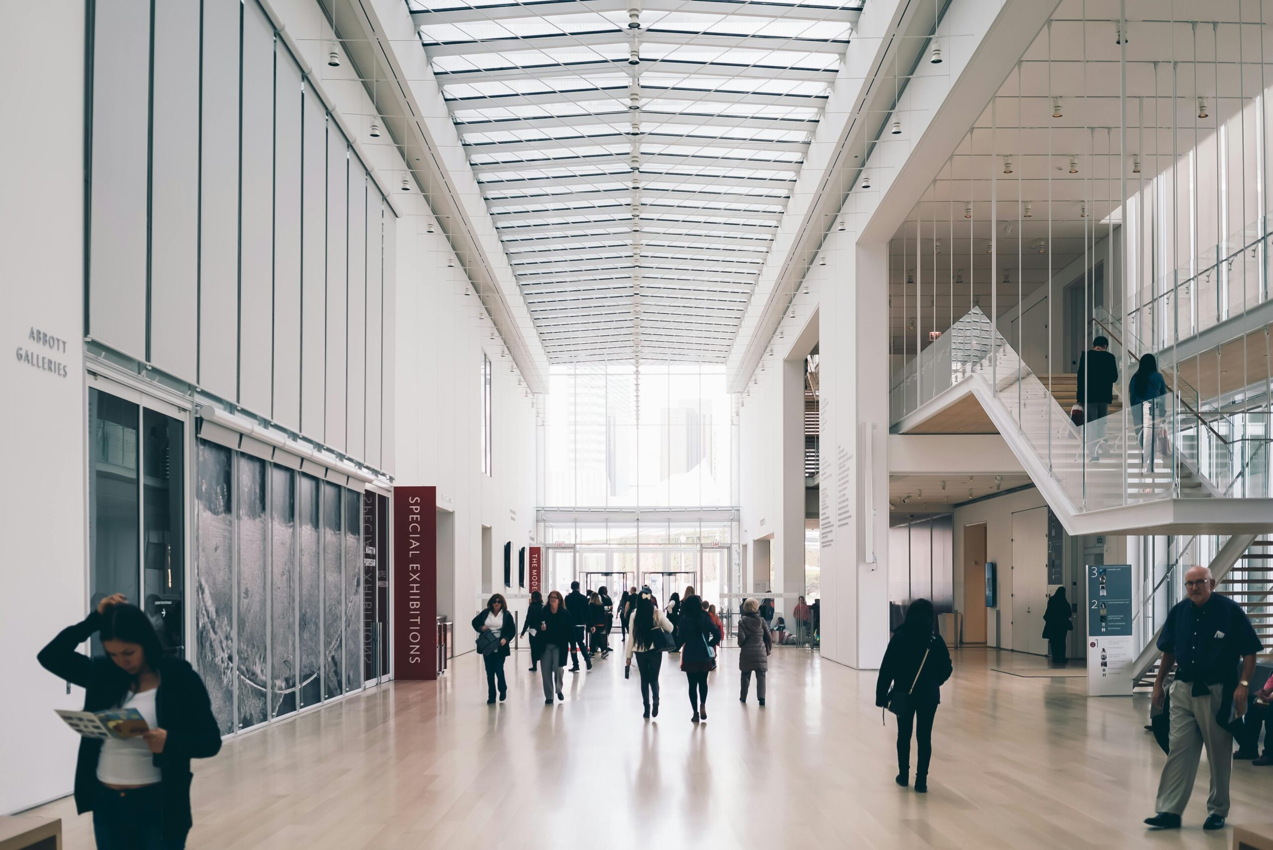 Visitors in a spacious modern art museum gallery on Nakanoshima