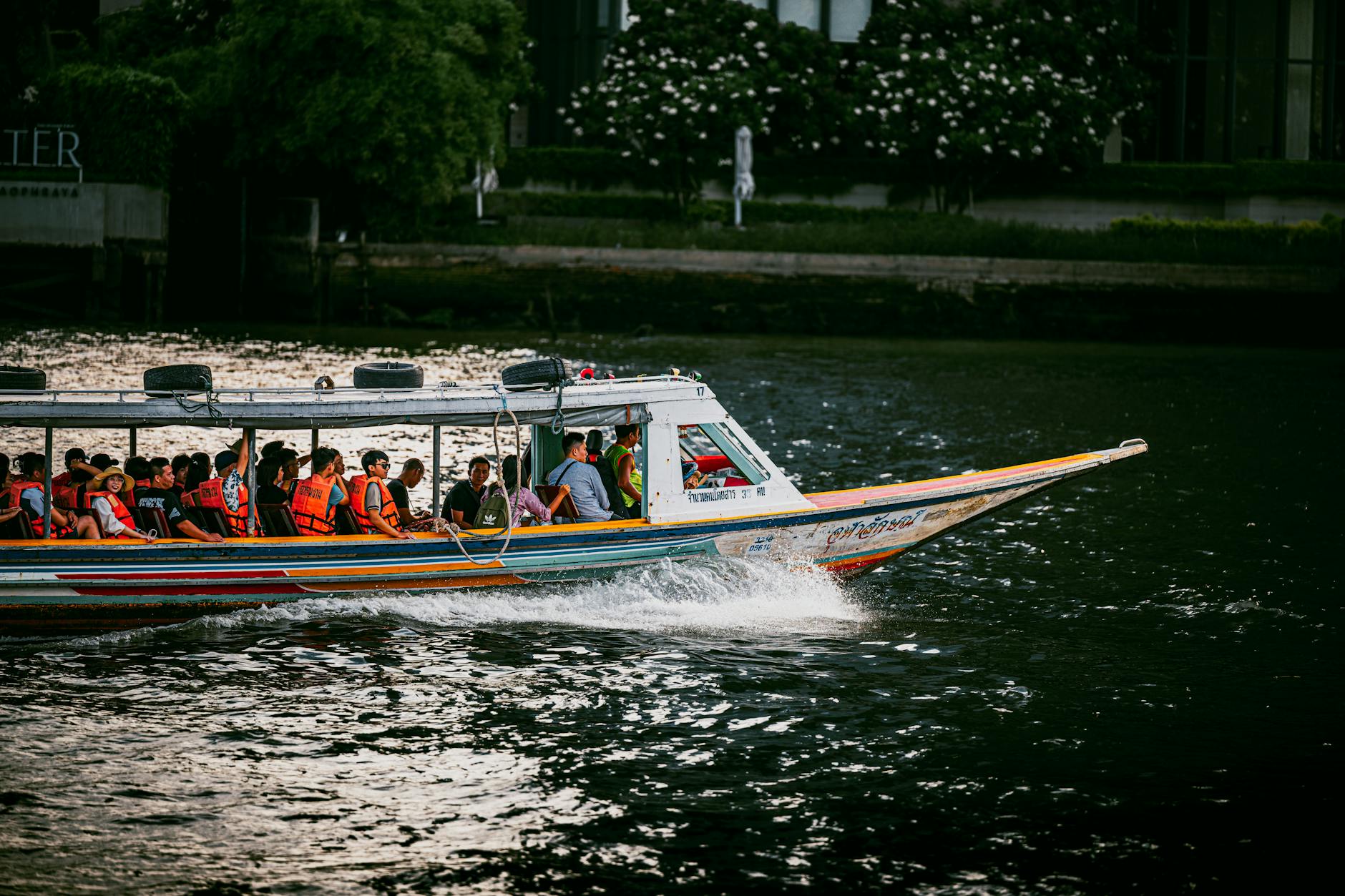Sightseeing boat passing under a bridge on an Osaka river cruise
