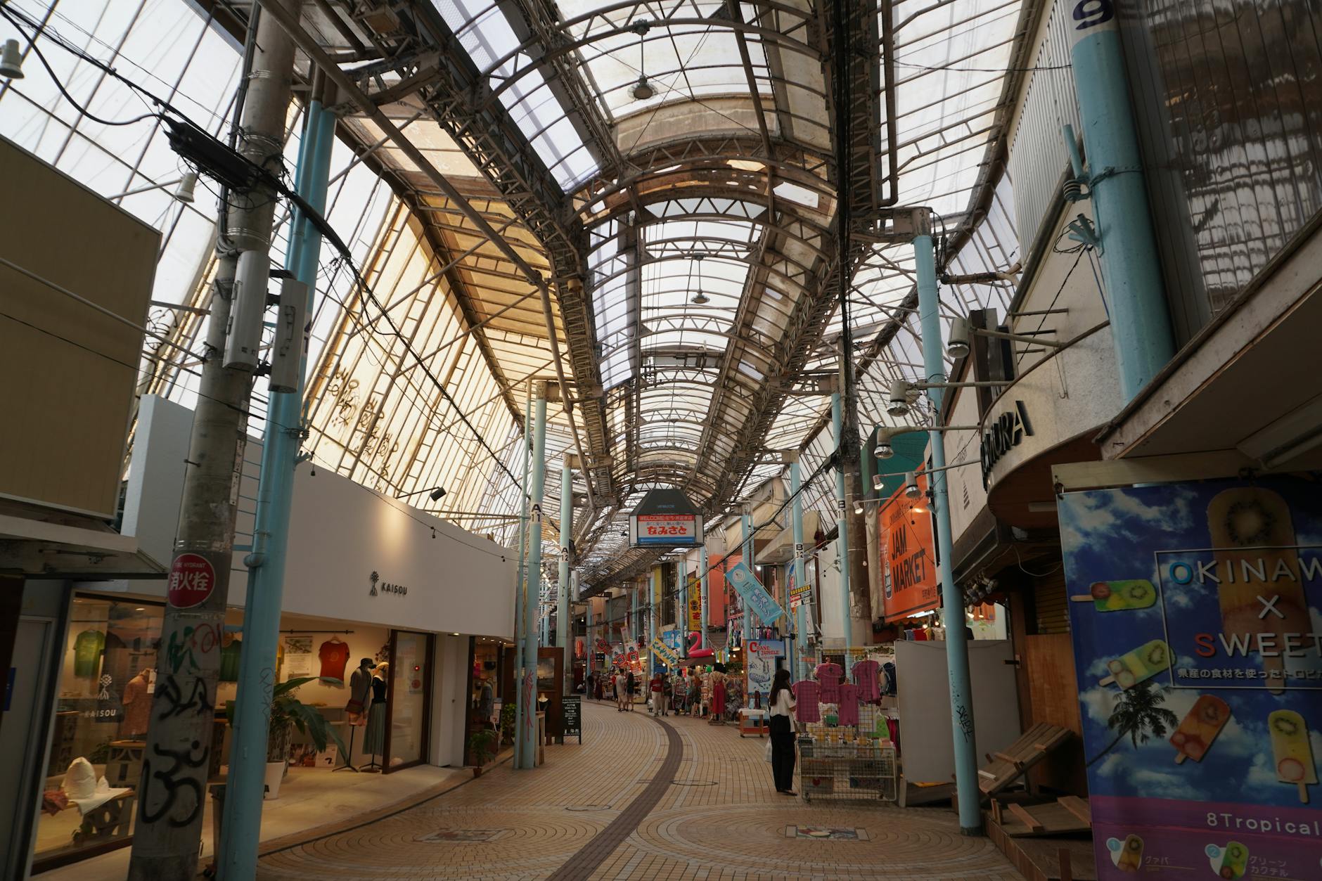 Shoppers in a covered shopping arcade near Shinsaibashi hotels in Osaka