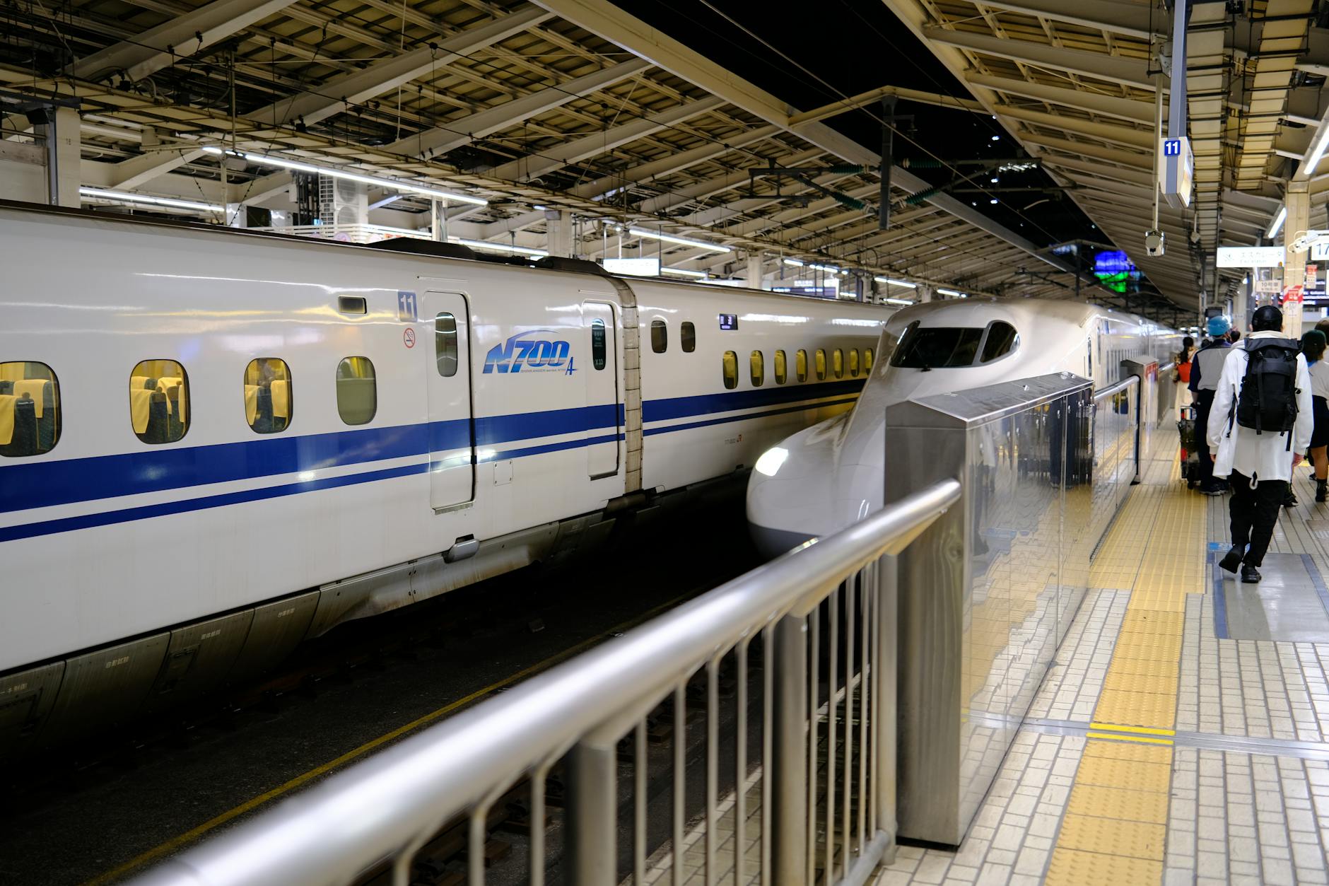 A shinkansen bullet train at a station platform near Umeda Osaka