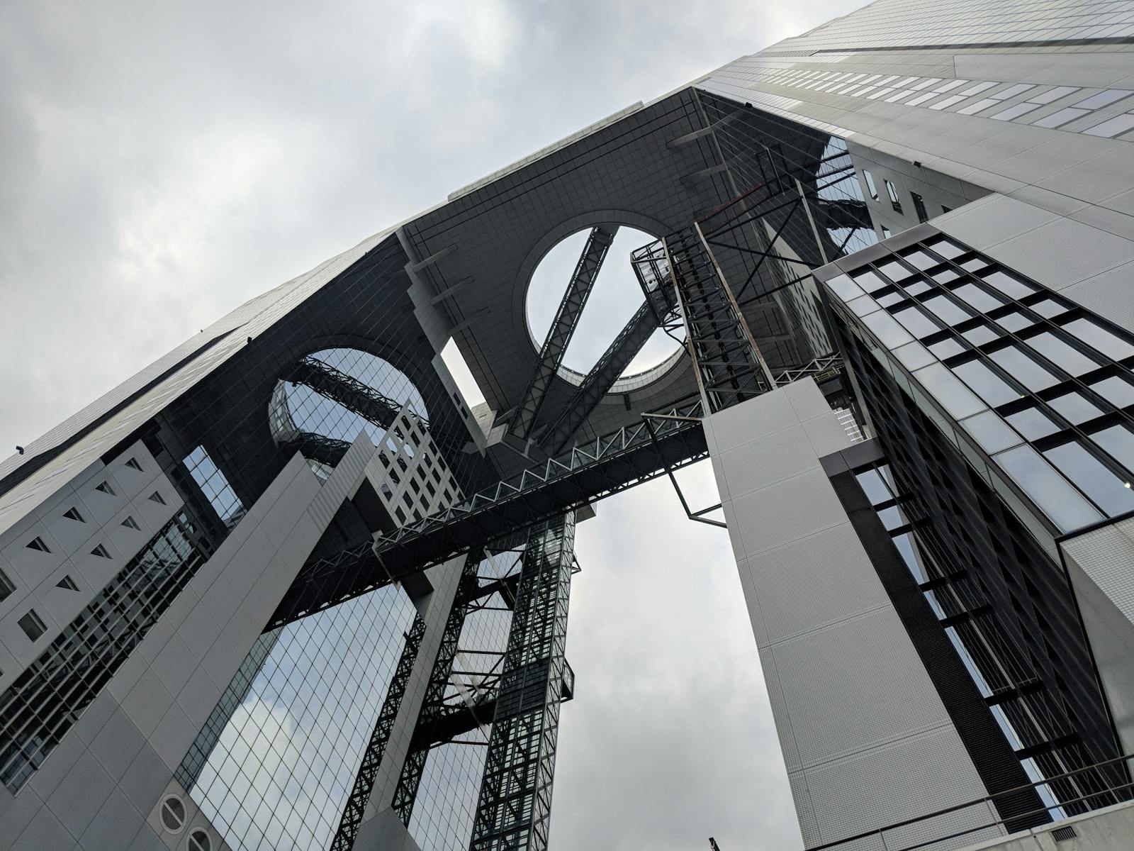 The twin towers of the Umeda Sky Building in Osaka seen from below