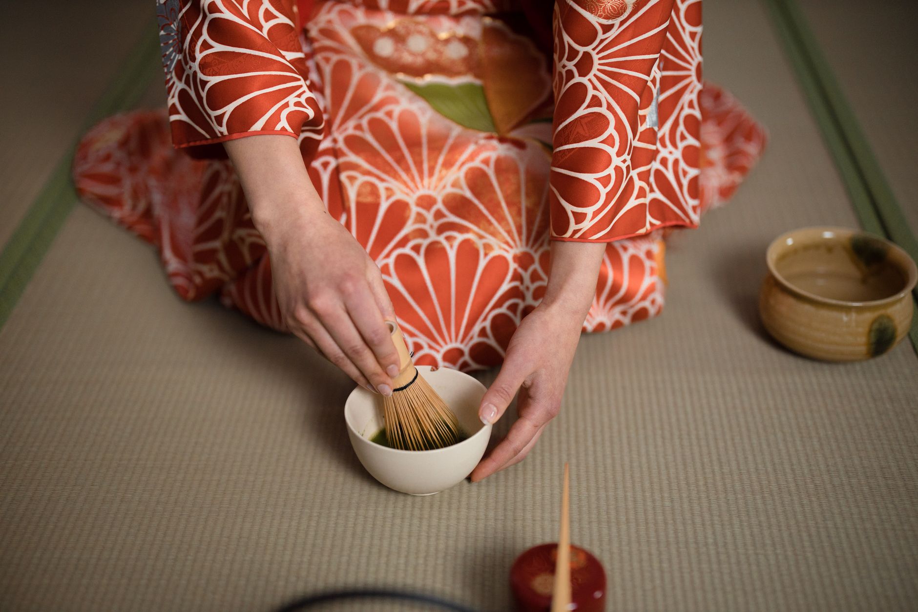 Matcha being whisked in a traditional tea ceremony, a nod to Sakai-born tea master Sen no Rikyu