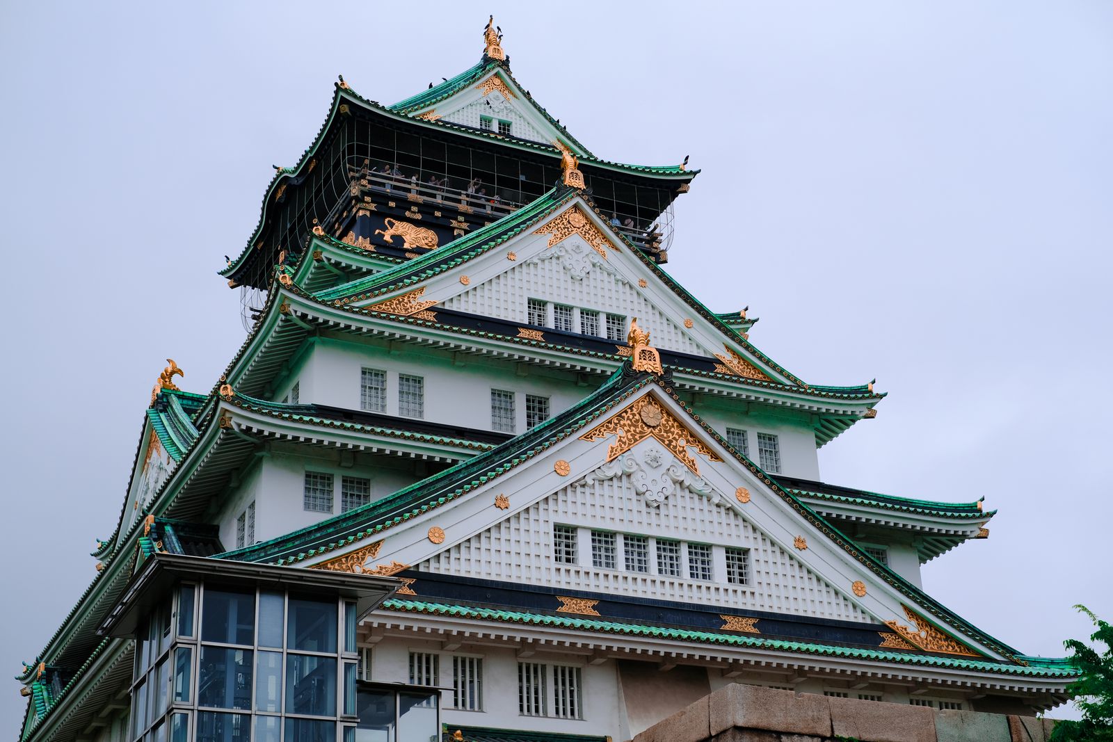 Osaka Castle main keep with green roofs and gold detailing, a fixture of every Osaka itinerary