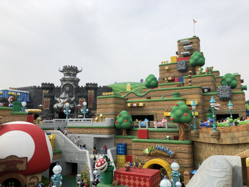 Colorful Mushroom Kingdom terraces, Yoshi vehicles and Bowser's Castle fill Super Nintendo World at Universal Studios Japan in Osaka.